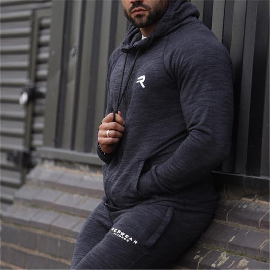 Men's Agate hooded sportswear jacket with front pockets and adjustable drawstrings, made for active wear and casual comfort.