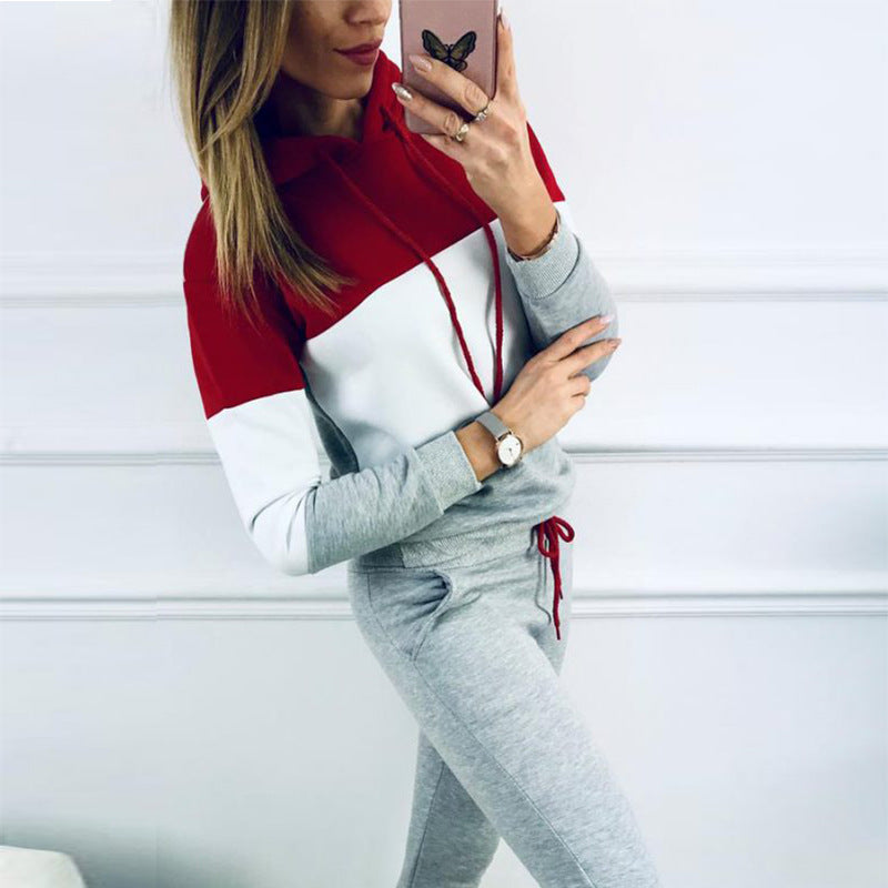 Black women's sportswear tracksuit with hood, casual autumn fashion by Agate, featuring a comfortable fit and stylish design.