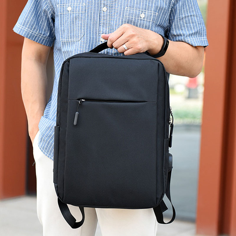 Black Agate laptop backpack with USB port, stylish business bag for men, featuring multiple compartments and durable design.