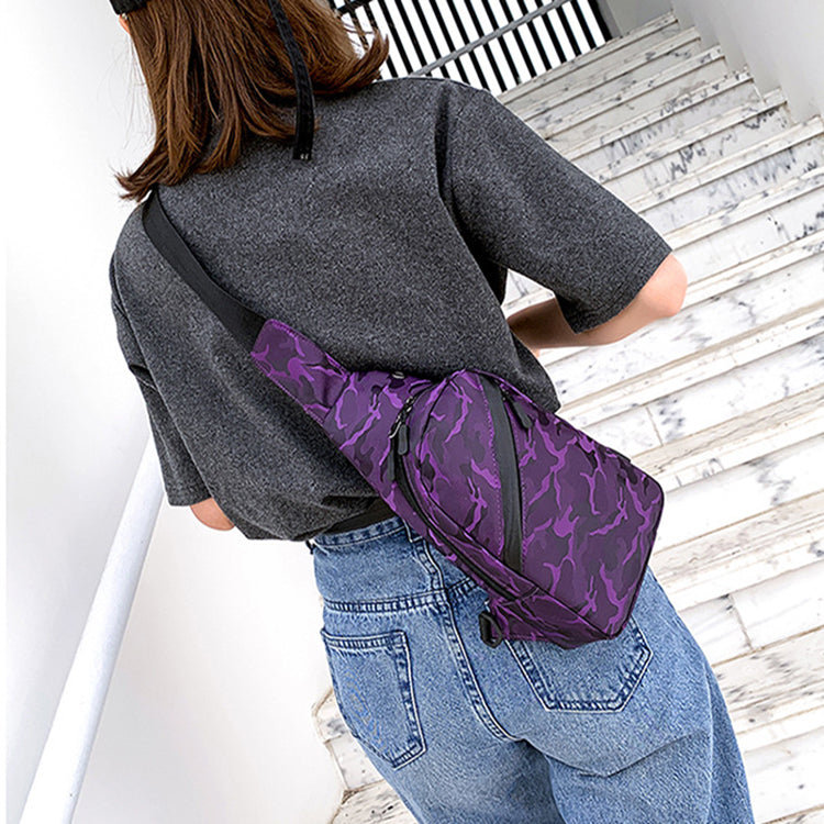 Black camouflage chest bag for men by Agate with a crossbody style and built-in headphone hole for easy listening.