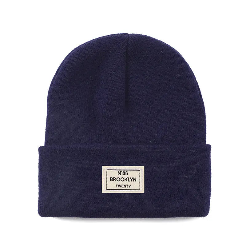 Knitted Beanie With Brand Label Stylish And Fashionable - Alvionz.de