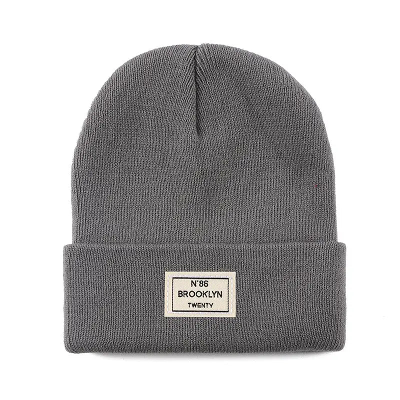 Knitted Beanie With Brand Label Stylish And Fashionable - Alvionz.de