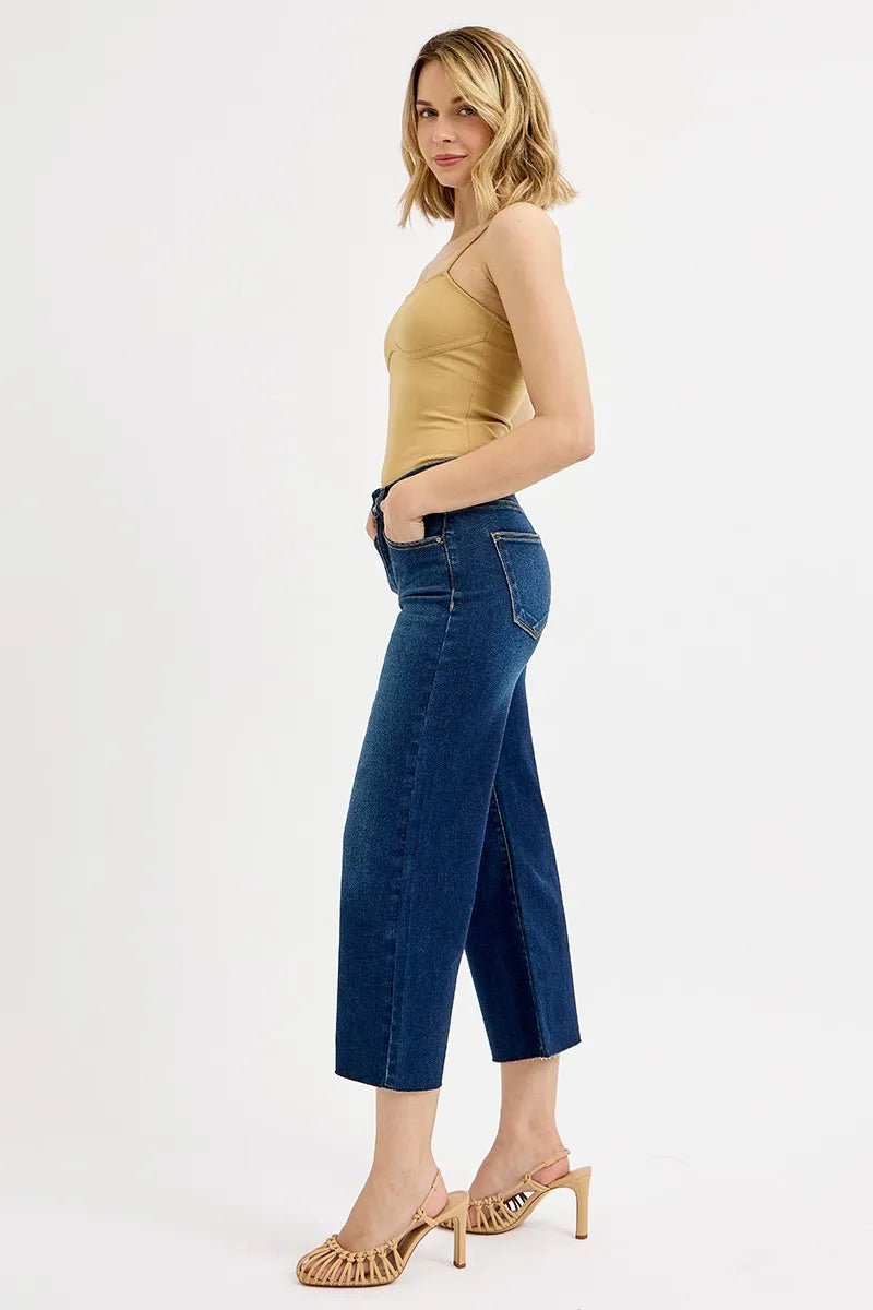 Dark wash Risen plus size high-rise crop wide jeans with tummy control and full size fit, styled for a casual look.