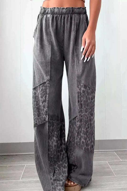 Dark gray mineral wash leopard patchwork loose pants from Trendsi, showing relaxed fit and stylish leopard print details.