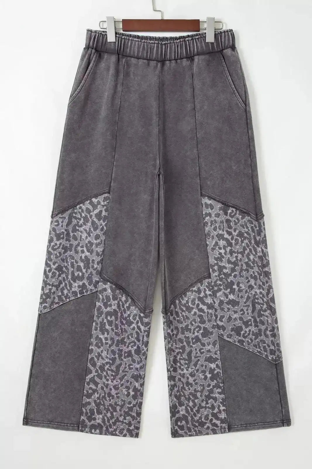 Dark gray mineral wash leopard patchwork loose pants by Trendsi, featuring relaxed fit and stylish animal print design.