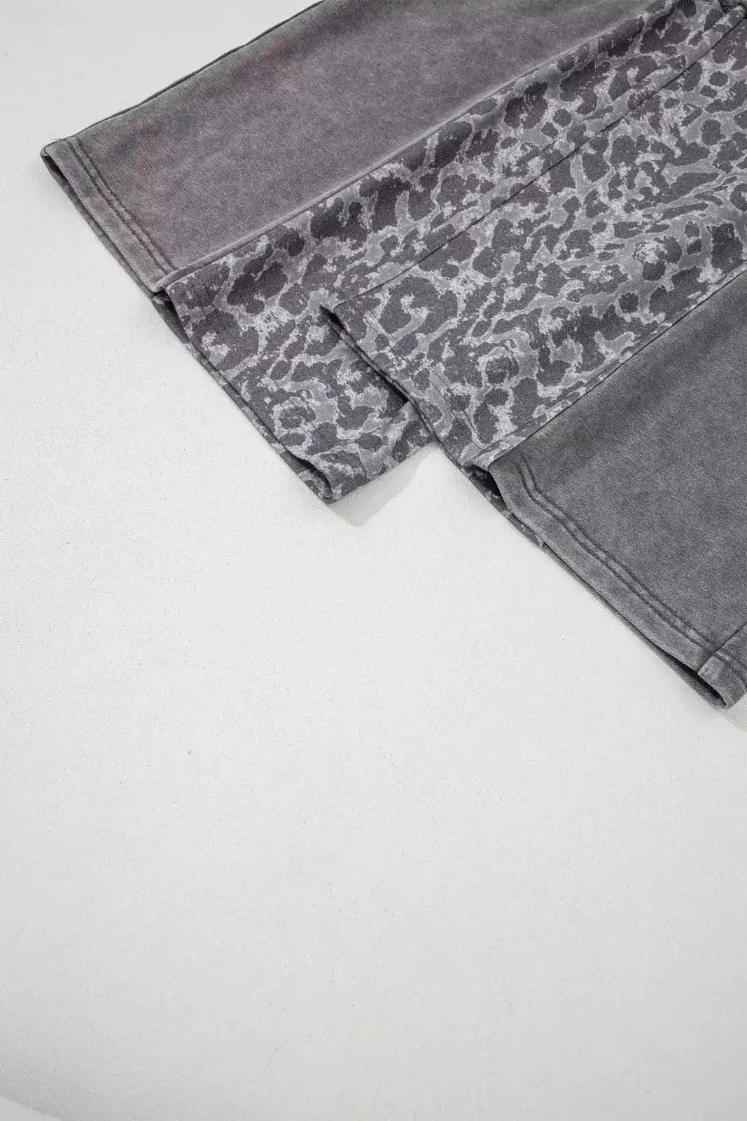 Dark gray mineral wash leopard patchwork loose pants by Trendsi, featuring relaxed fit and stylish animal print design.