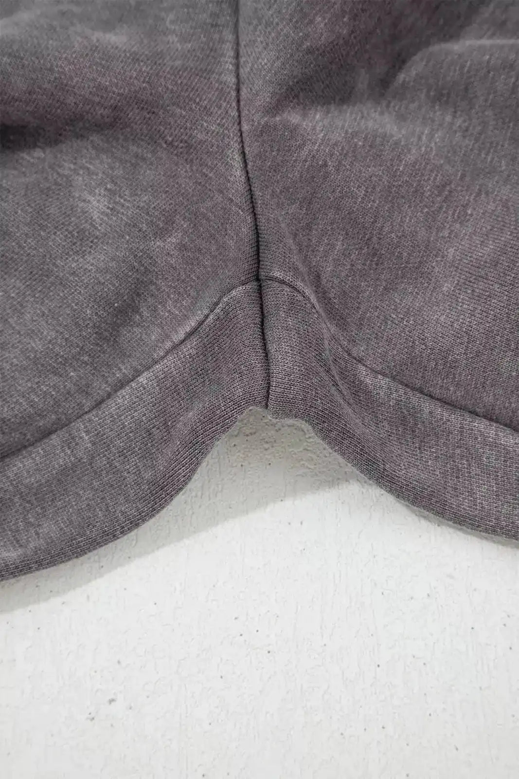 Dark gray mineral wash leopard patchwork loose pants from Trendsi, showcasing relaxed fit and stylish animal print design.