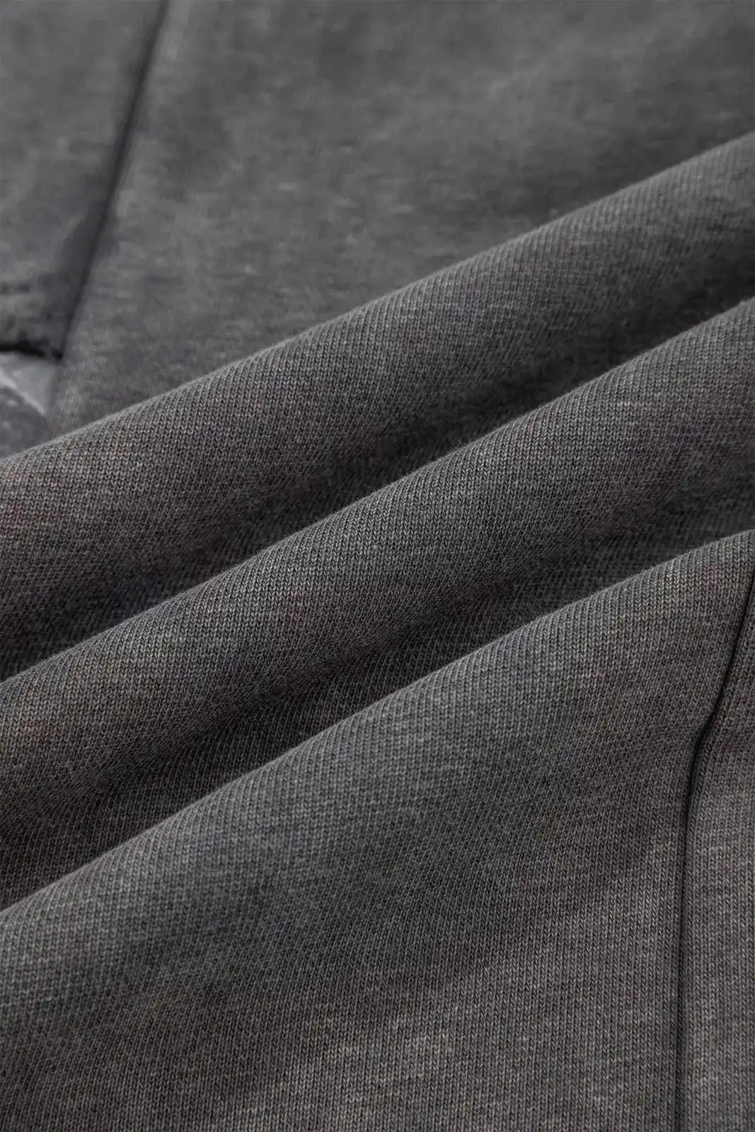 Dark gray mineral wash leopard patchwork loose pants by Trendsi, featuring a relaxed fit and stylish animal print design.