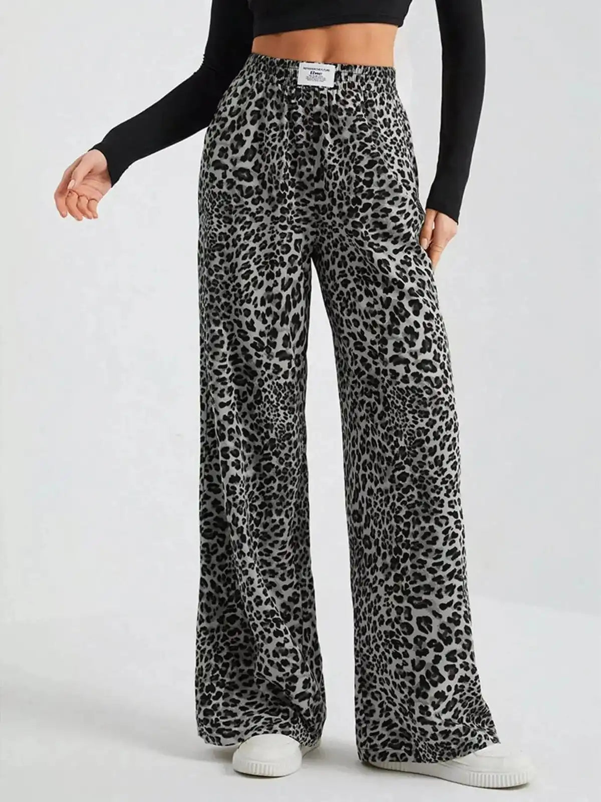Plus size leopard print wide-leg pants by Trendsi, showcasing full length and bold animal pattern for a stylish look.