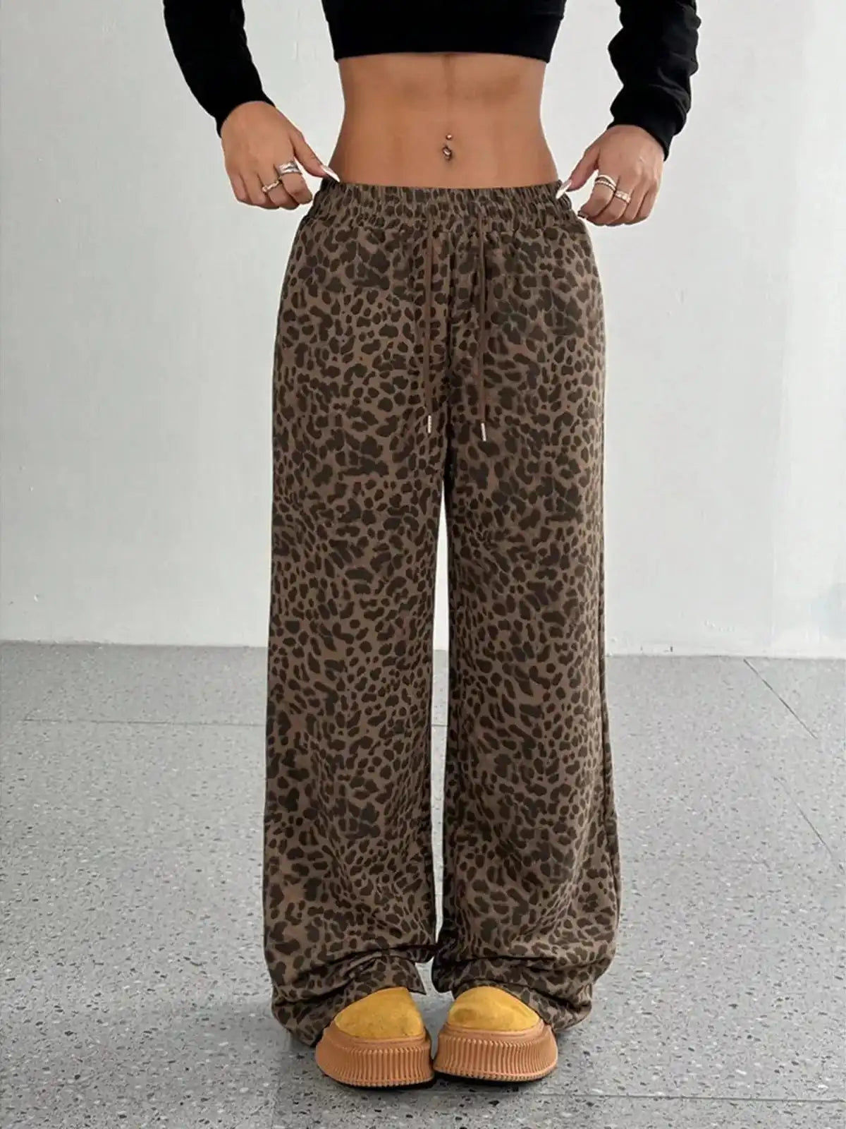 Plus size leopard print wide-leg pants from Trendsi, showcasing their full length and bold animal print design.