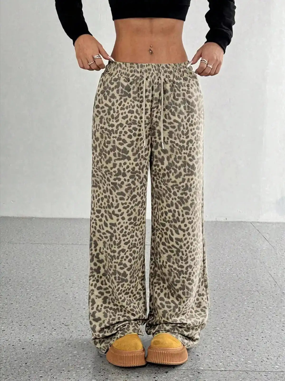 Plus size leopard print wide-leg pants by Trendsi, full length, stylish and comfortable for casual or fashionable wear.