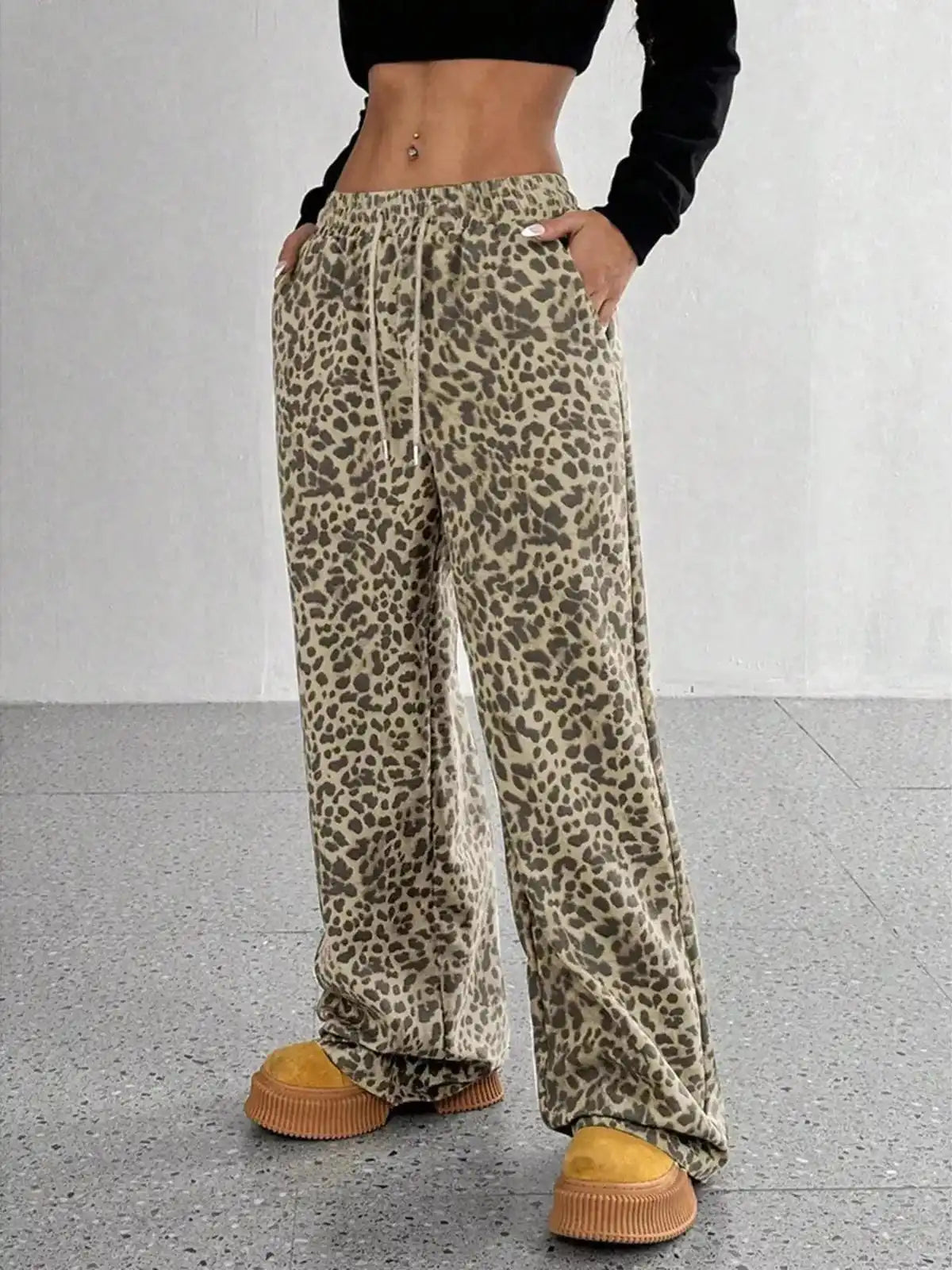 Full size leopard print wide-leg pants from Trendsi, plus size, with a comfortable fit and stylish animal print design.
