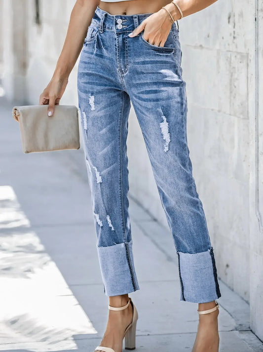 Light blue high waist distressed straight leg jeans from Trendsi, featuring ripped details and classic denim style.
