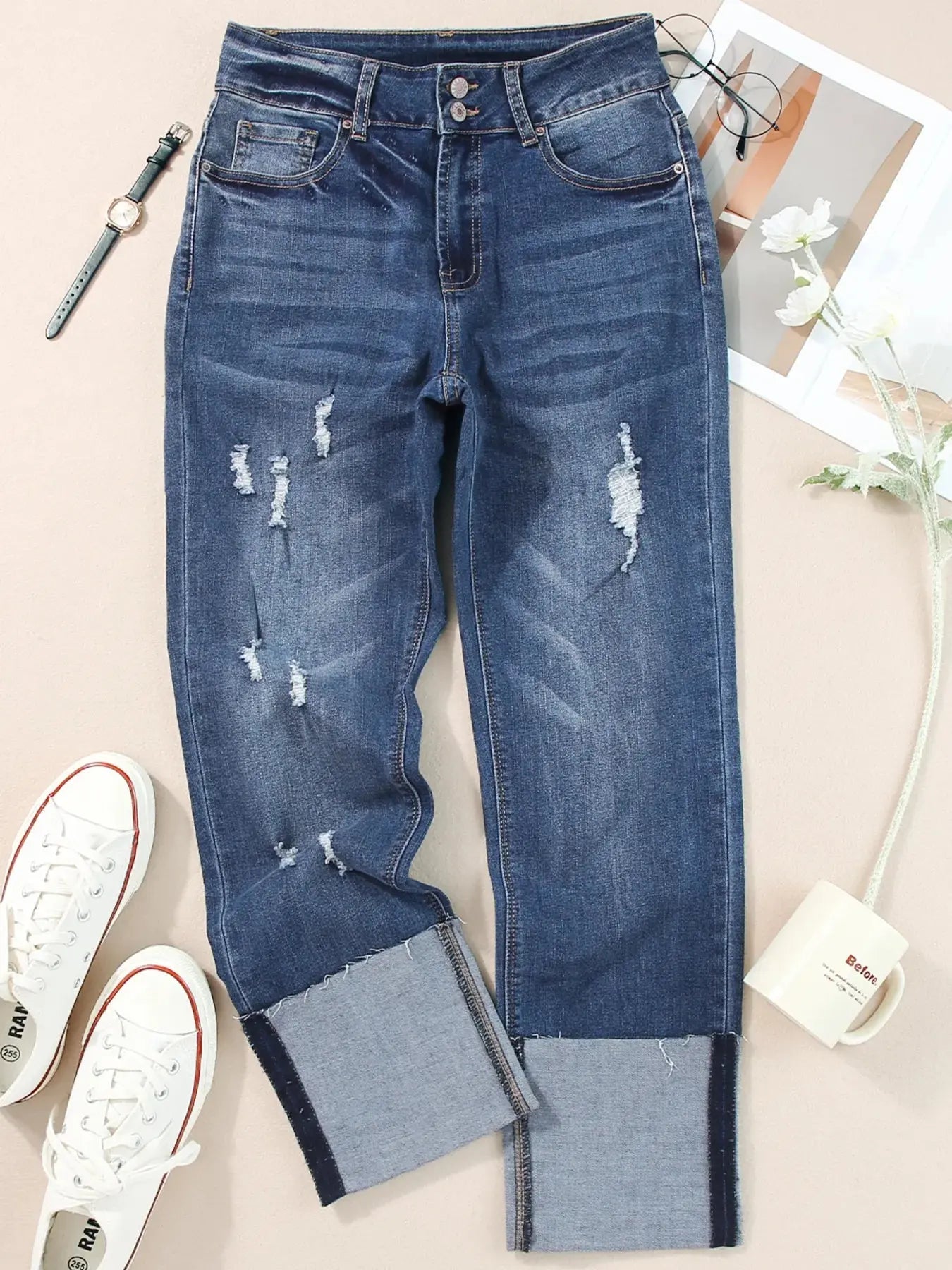 Light blue high waist distressed straight leg jeans from Trendsi, showing fit and detailing on a model.