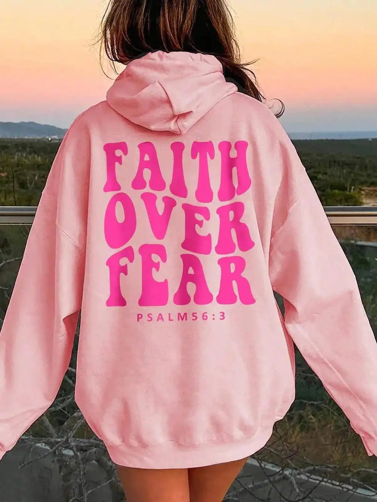 Pink FAITH OVER FEAR dropped shoulder hoodie by Trendsi, featuring a relaxed fit and casual style.
